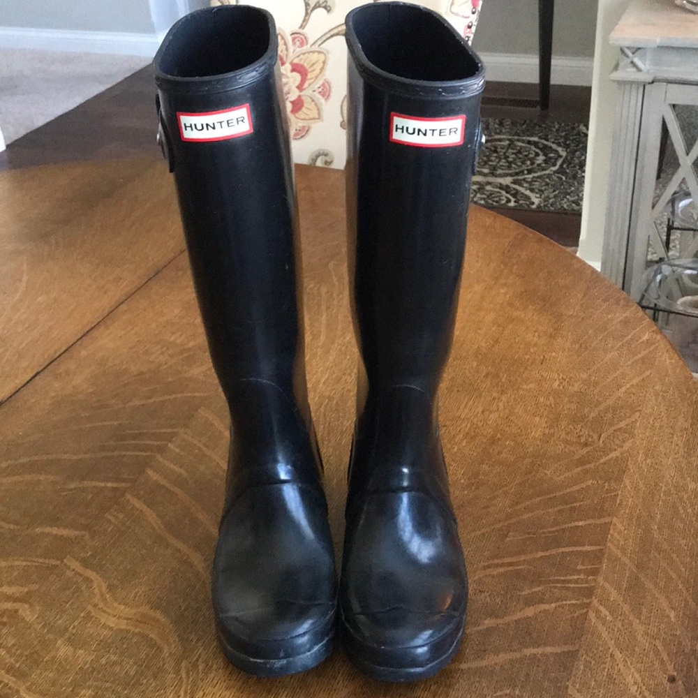 Tall black glossy hunter rain boots